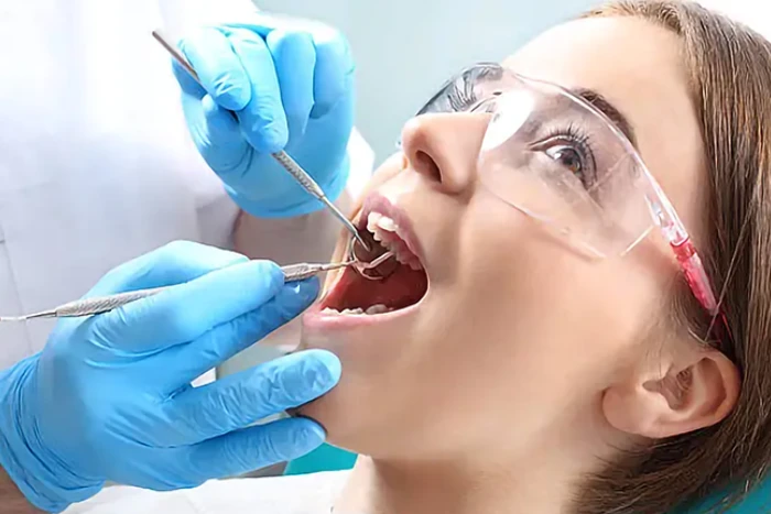 dentist providing root canal treatment